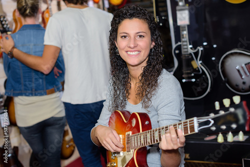 portrait of a beautiful woman with a guitar