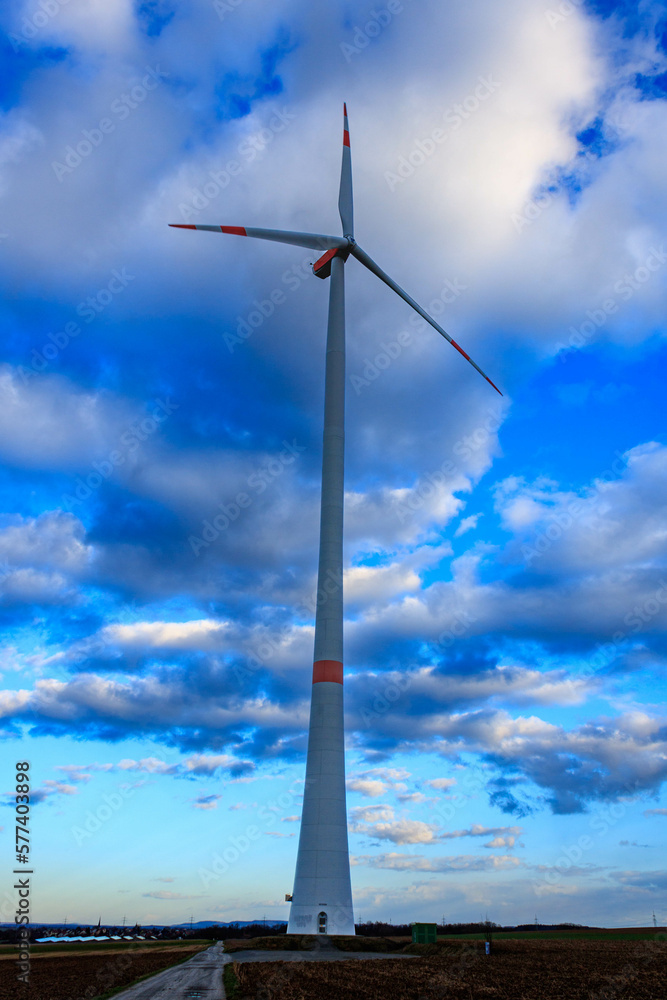 Windmill in blue cloudy sky in Bavaria, Germany