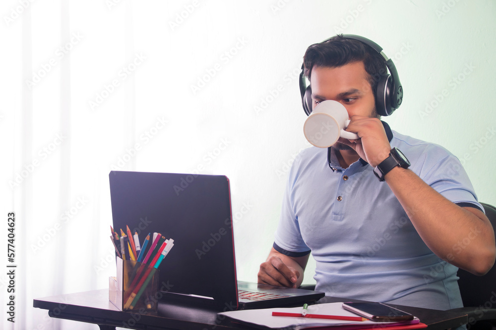 Teenage boy drinking coffee during study at home Teenage boy drinking coffee during study at home