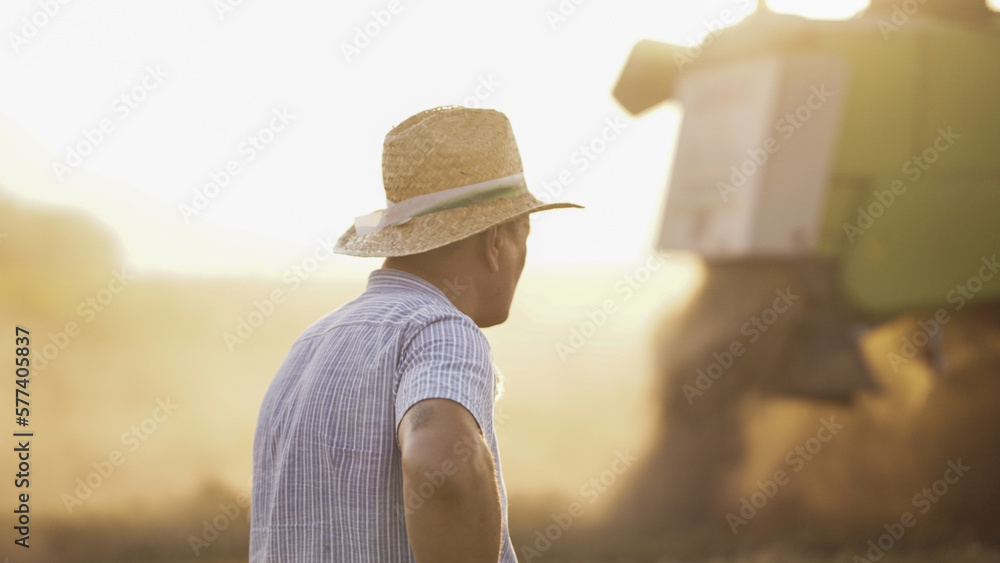 Farmer working on the field combine
