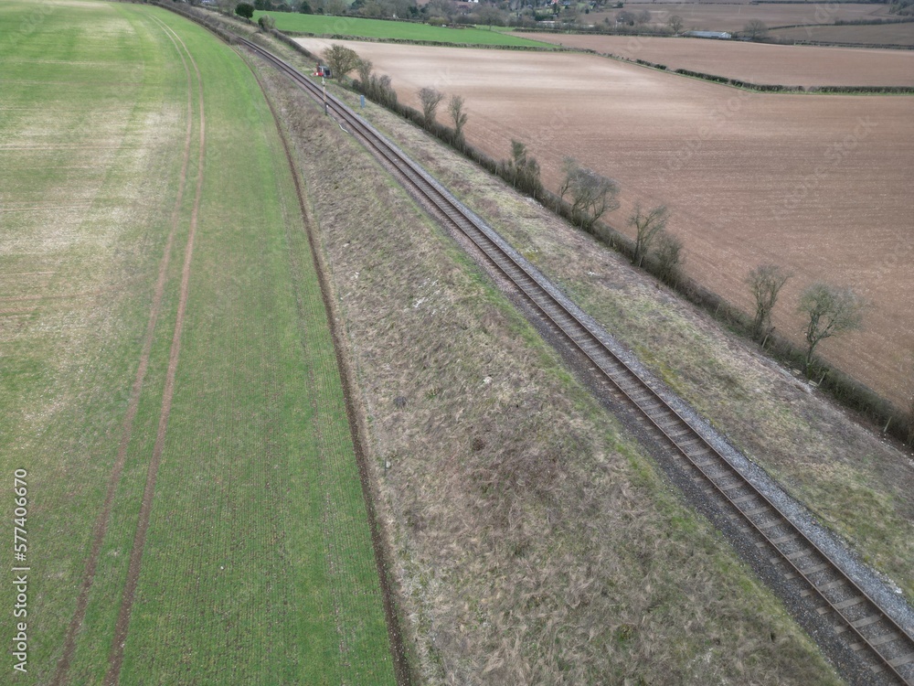 A single railway track in an elevated rural position A single railway track in an elevated rural position