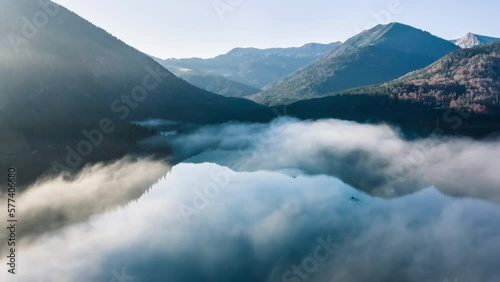 Morning fog dissolving over Sylvenstein dam, Bavaria Germany photo