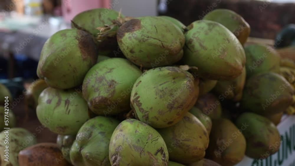 Many beautiful fresh ripe coconuts are lying on ground. Coconut milk. Healthy eating. Vitamins and trace elements. Many beautiful fresh ripe coconuts are lying on ground. Coconut milk. Healthy eating. Vitamins and trace elements.
