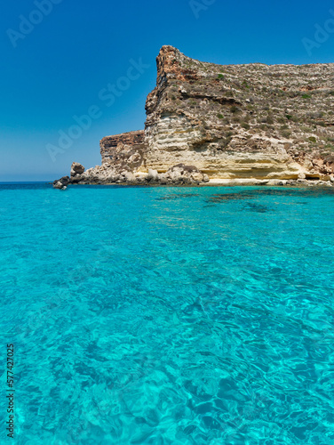 blue sea and blue sky rocks lampedusa rabbits beach sicily italy meditherranean sea