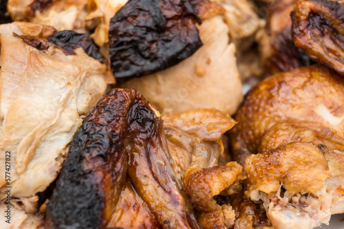 Closeup of a plate of chopped Lechon Manok, or roasted chicken. photo