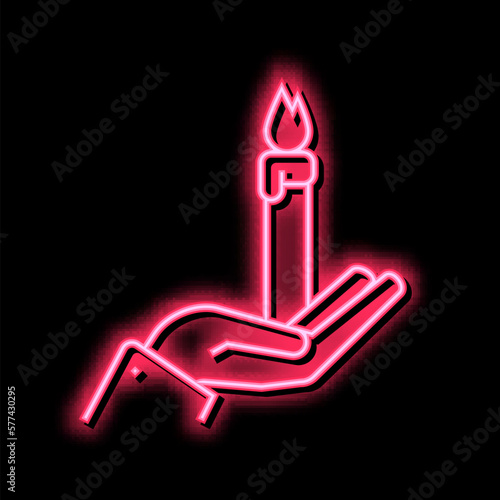 hand holding burning candle neon glow icon illustration