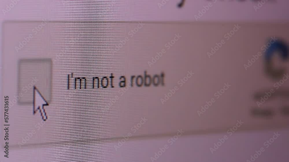 Mouse Cursor And "I'm Not a Robot" Button on Computer Screen. Close Up