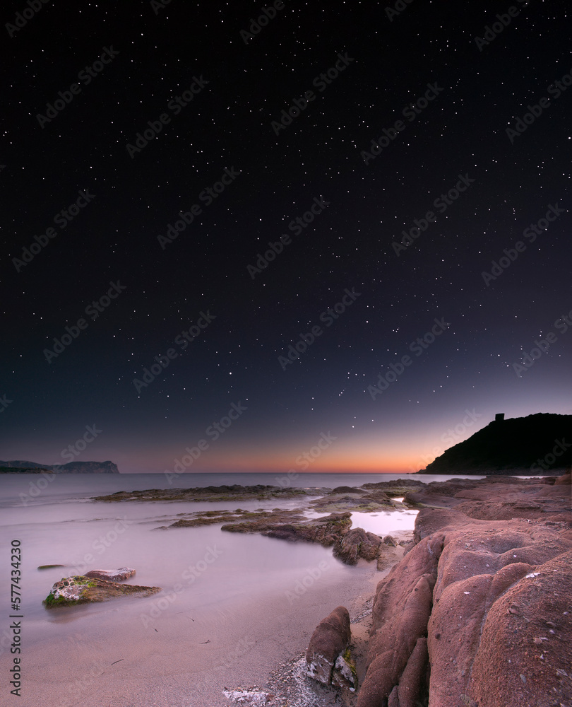 Quiet bay at night under the stars. Porto Ferro, Sardinia. Italy