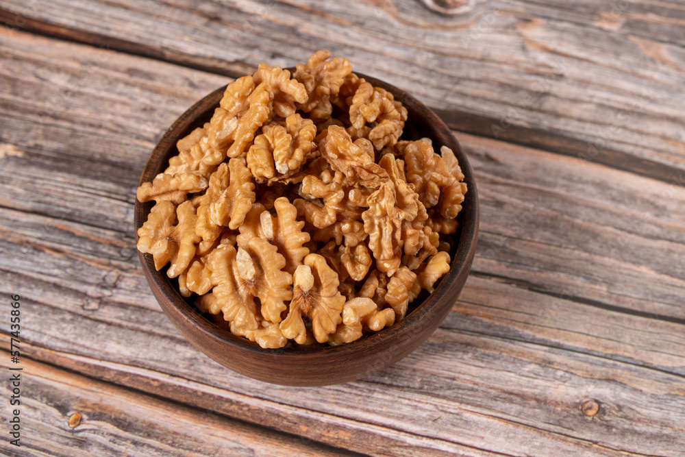 walnuts on wooden table walnuts on wooden table