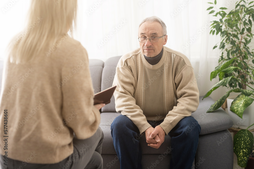 Fototapeta premium Caregiver psychologist console american senior people for mental health, geriatric psychology, Depressed senior man talking with female psychologist, desperate people, emotions sad, elderly worry