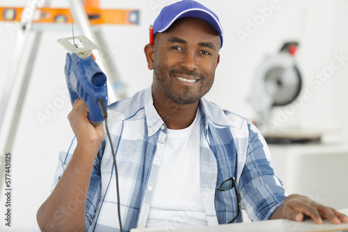 happy construction worker posing at workplace