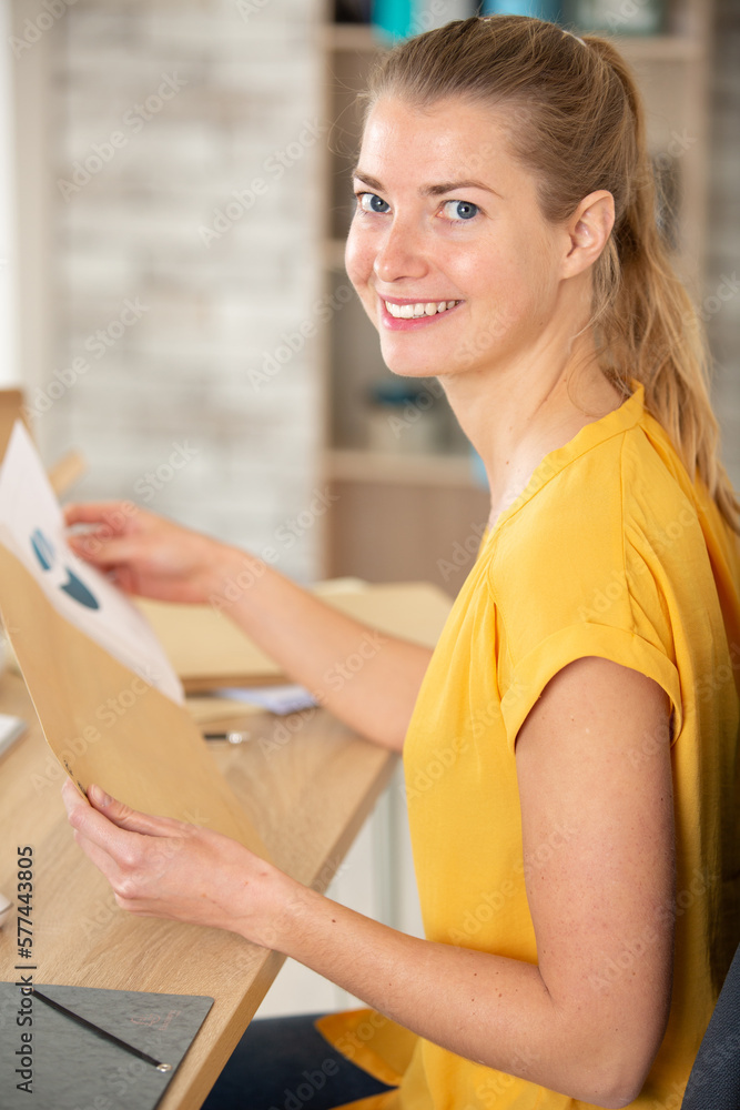 business lady filling envelope with business documents business lady filling envelope with business documents