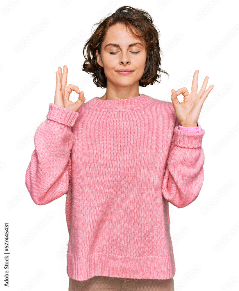 Young hispanic woman wearing casual clothes relaxed and smiling with eyes closed doing meditation gesture with fingers. yoga concept. Young hispanic woman wearing casual clothes relaxed and smiling with eyes closed doing meditation gesture with fingers. yoga concept.