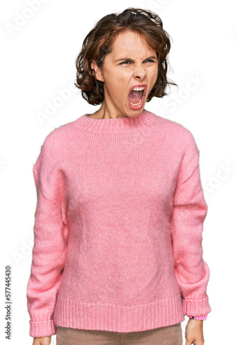 Young hispanic woman wearing casual clothes angry and mad screaming frustrated and furious, shouting with anger. rage and aggressive concept.