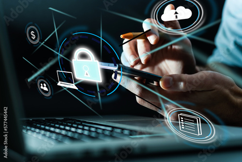 Vászonkép Cyber security and futuristic technology concept businessman using finger to touch fingerprint interface,to scan password,with technology icons and padlock,with artificial intelligence system or ai