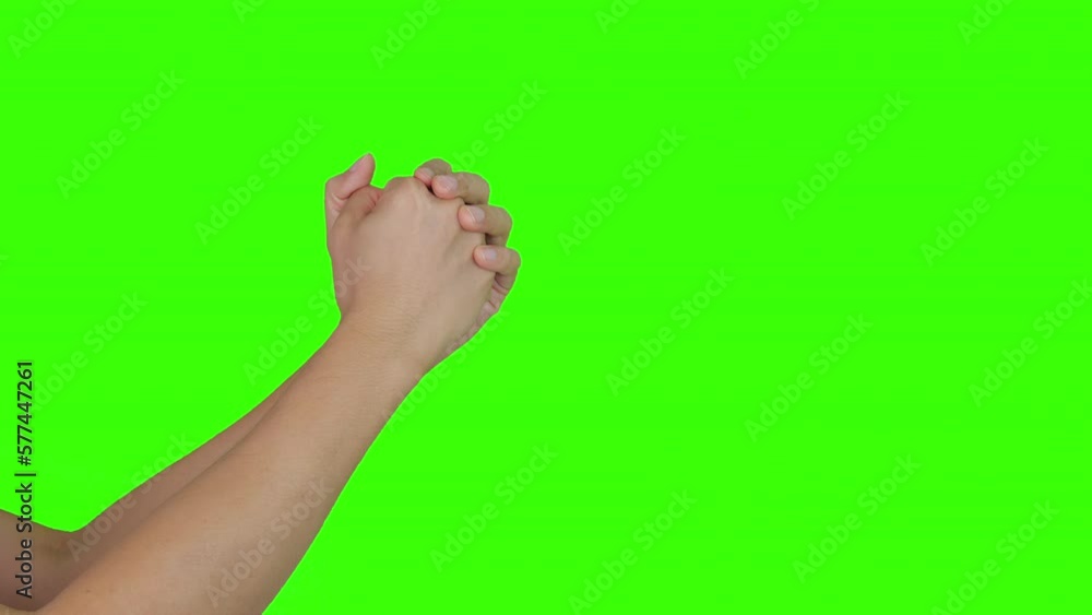 Male hands praying to God, green background Male hands praying to God, green background