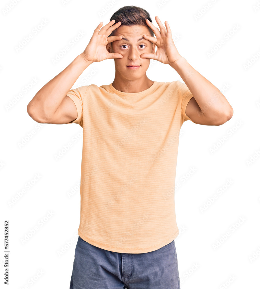 Young handsome man wearing casual clothes trying to open eyes with fingers, sleepy and tired for morning fatigue Young handsome man wearing casual clothes trying to open eyes with fingers, sleepy and tired for morning fatigue