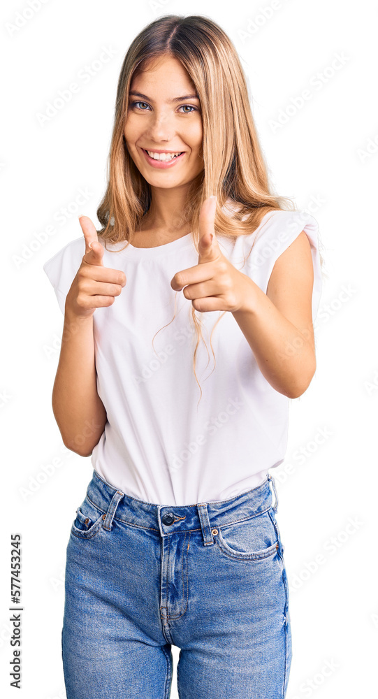 Beautiful caucasian woman with blonde hair wearing casual white tshirt pointing fingers to camera with happy and funny face. good energy and vibes. Beautiful caucasian woman with blonde hair wearing casual white tshirt pointing fingers to camera with happy and funny face. good energy and vibes.
