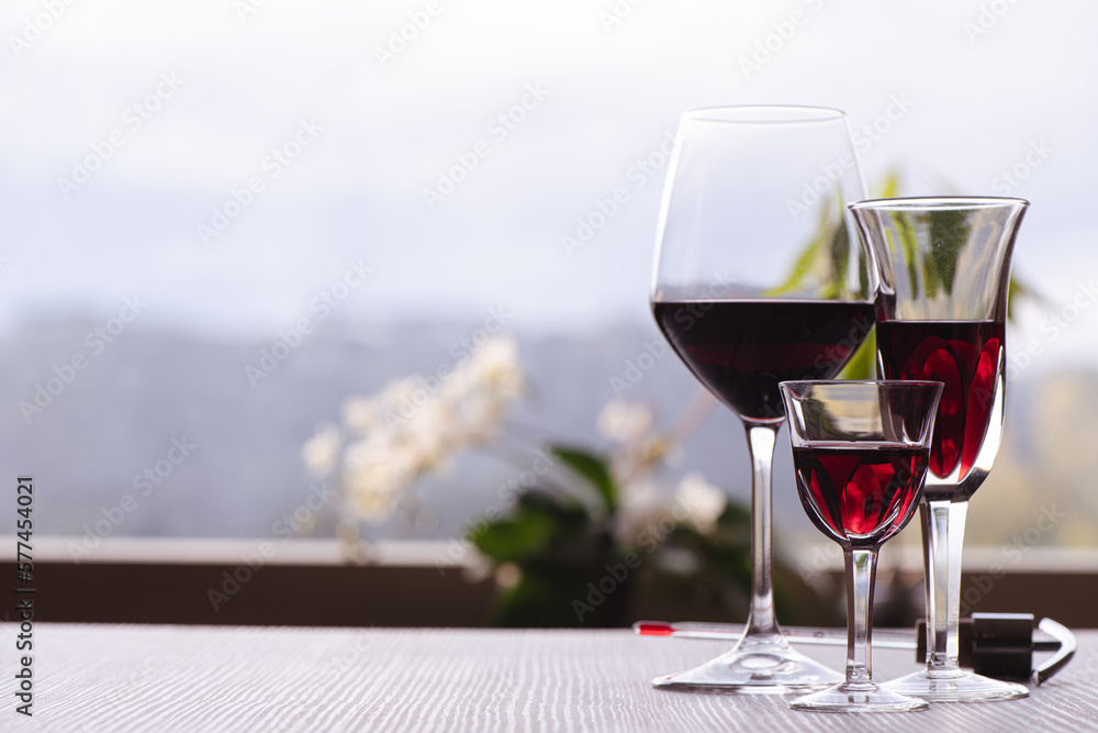 Elegant glasses of wine on a kitchen table