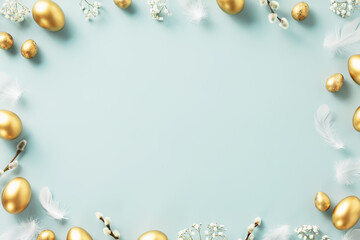 Happy Easter concept with golden easter eggs, feathers and spring flowers. Easter background with copy space. Flat lay
