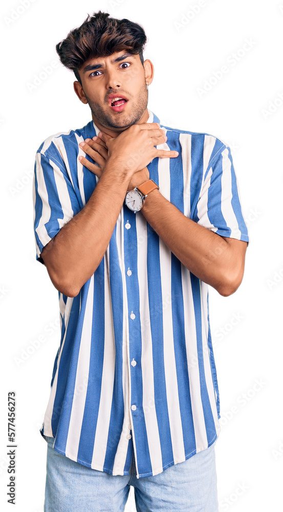 Young hispanic man wearing casual clothes shouting suffocate because painful strangle. health problem. asphyxiate and suicide concept. Young hispanic man wearing casual clothes shouting suffocate because painful strangle. health problem. asphyxiate and suicide concept.