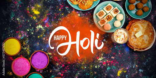 Happy Holi. Traditional Indian festival food and powder colors, top view. Happy Holi concept. photo