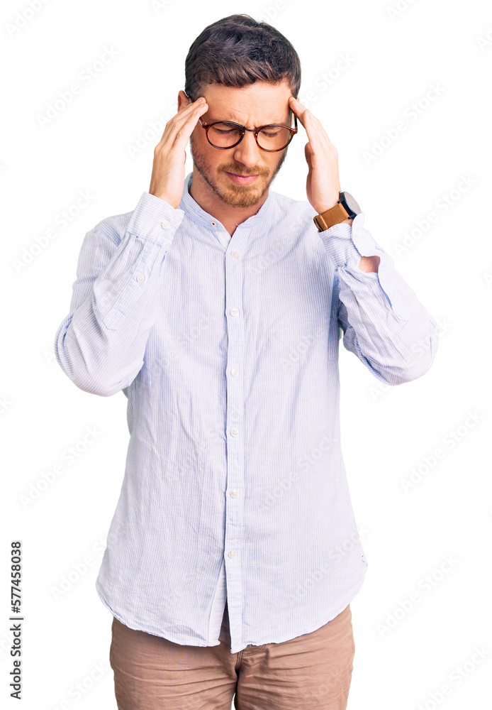 Handsome young man with bear wearing elegant business shirt and glasses with hand on head, headache because stress. suffering migraine. Handsome young man with bear wearing elegant business shirt and glasses with hand on head, headache because stress. suffering migraine.
