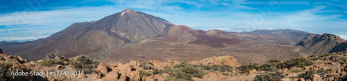 Panoramic wide close up view on colorful volcano pico del teide highest spanish mountain in Tenerife Canary island from mount Alto de Guajara with blue sky background. Horizontal, copy space photo
