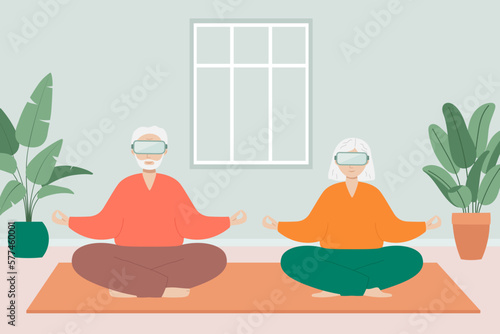 Senior man and woman sit cross-legged and meditate wearing VR glasses. Old man and woman make morning yoga or breathing exercises at home.