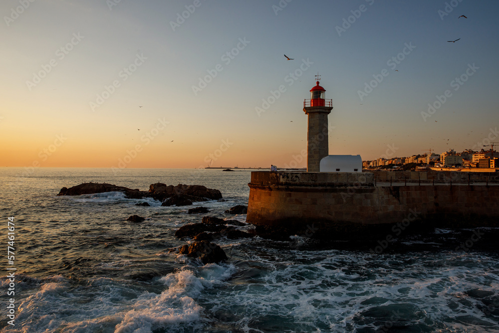 Ocean lighthouse at the sunset.