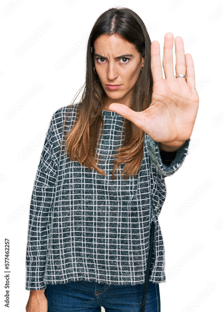 Young beautiful woman wearing casual clothes doing stop sing with palm of the hand. warning expression with negative and serious gesture on the face. Young beautiful woman wearing casual clothes doing stop sing with palm of the hand. warning expression with negative and serious gesture on the face.
