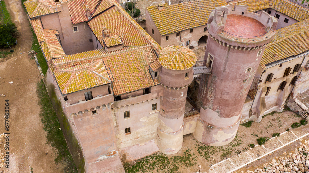 Aerial closeup of the towers of the Castle of Santa Severa. It's located in Santa Marinella in Lazio, in the Metropolitan City of Rome, Italy.It's a medieval castle built on the beach and over the sea