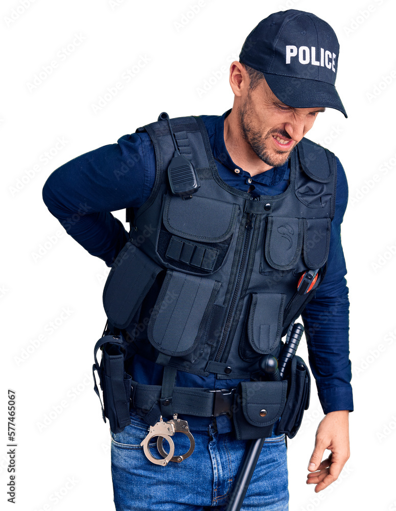 Young handsome man wearing police uniform suffering of backache, touching back with hand, muscular pain Young handsome man wearing police uniform suffering of backache, touching back with hand, muscular pain