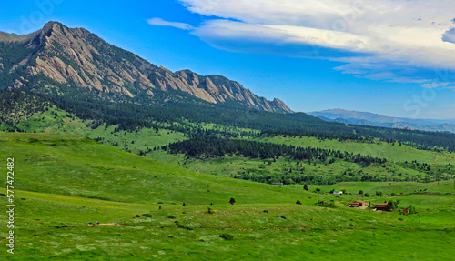 The city of Boulder, Colorado, buys up undeveloped property and preserves it as protected open space for the public, like these acres of greenery near the Flatirons 