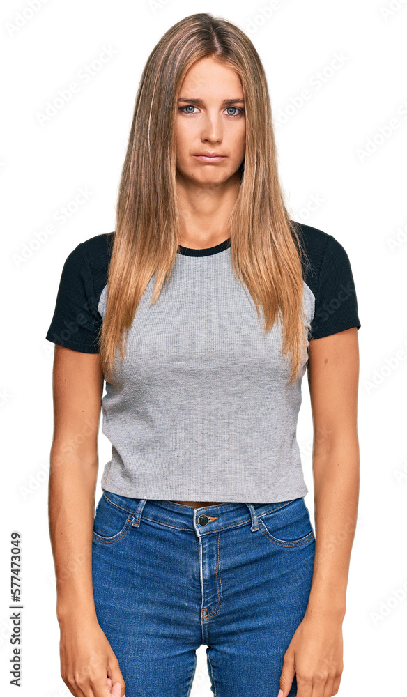 Obraz premium Young blonde woman wearing casual clothes skeptic and nervous, frowning upset because of problem. negative person.