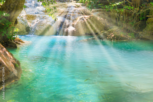 Tropical landscape with beautiful waterfall and emerald lake in green wild jungle forest. Erawan National park  Kanchanaburi  Thailand