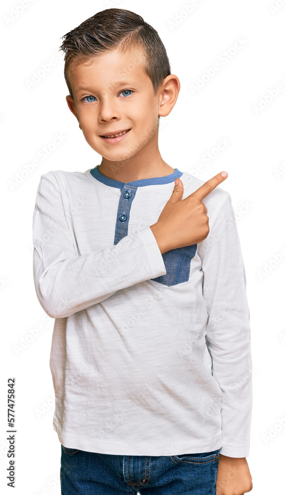 Adorable caucasian kid wearing casual clothes cheerful with a smile of face pointing with hand and finger up to the side with happy and natural expression on face Adorable caucasian kid wearing casual clothes cheerful with a smile of face pointing with hand and finger up to the side with happy and natural expression on face