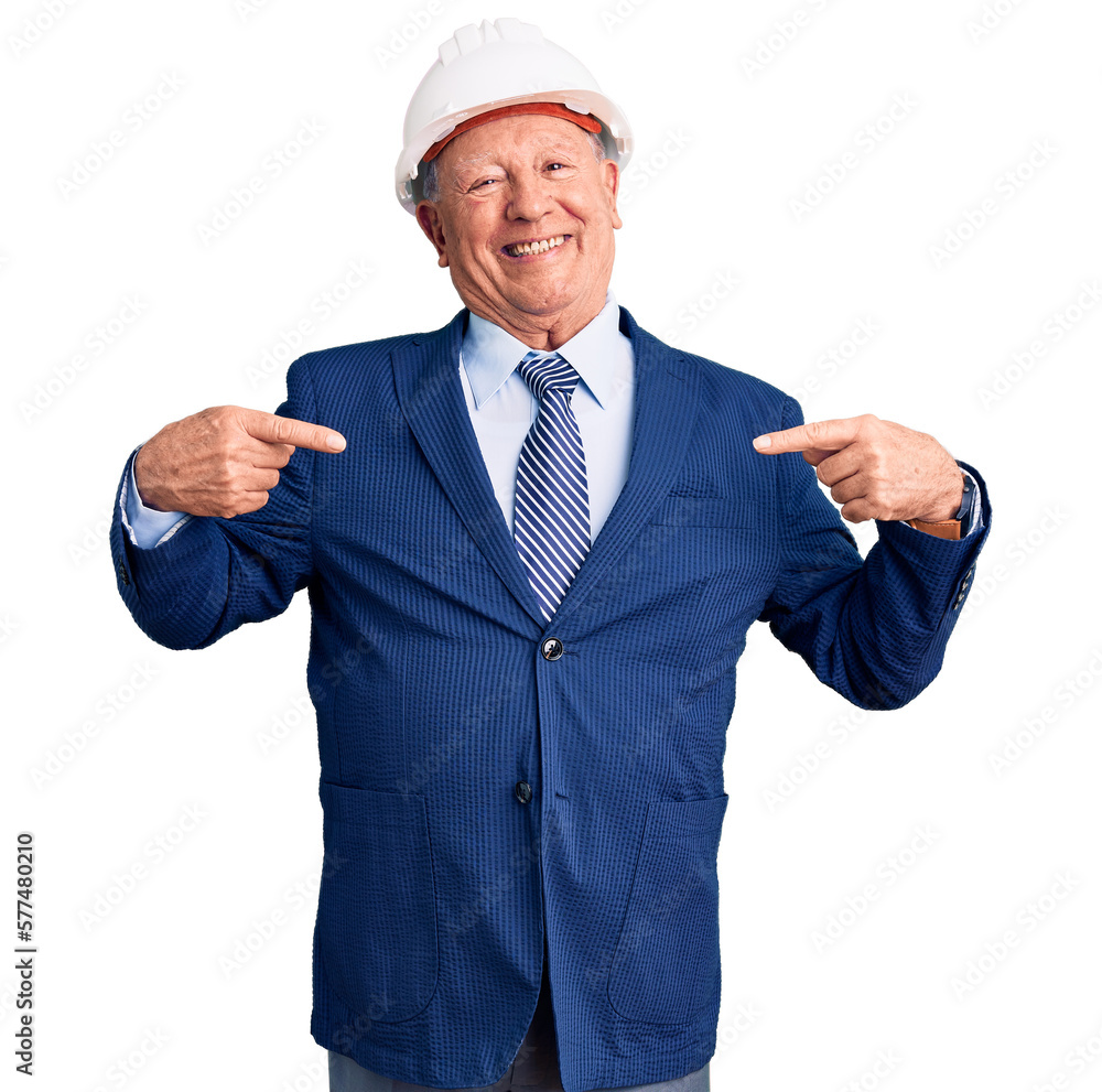 Senior handsome grey-haired man wearing suit and architect hardhat looking confident with smile on face, pointing oneself with fingers proud and happy.