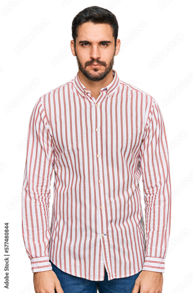 Fototapeta premium Young hispanic man wearing business shirt skeptic and nervous, frowning upset because of problem. negative person.