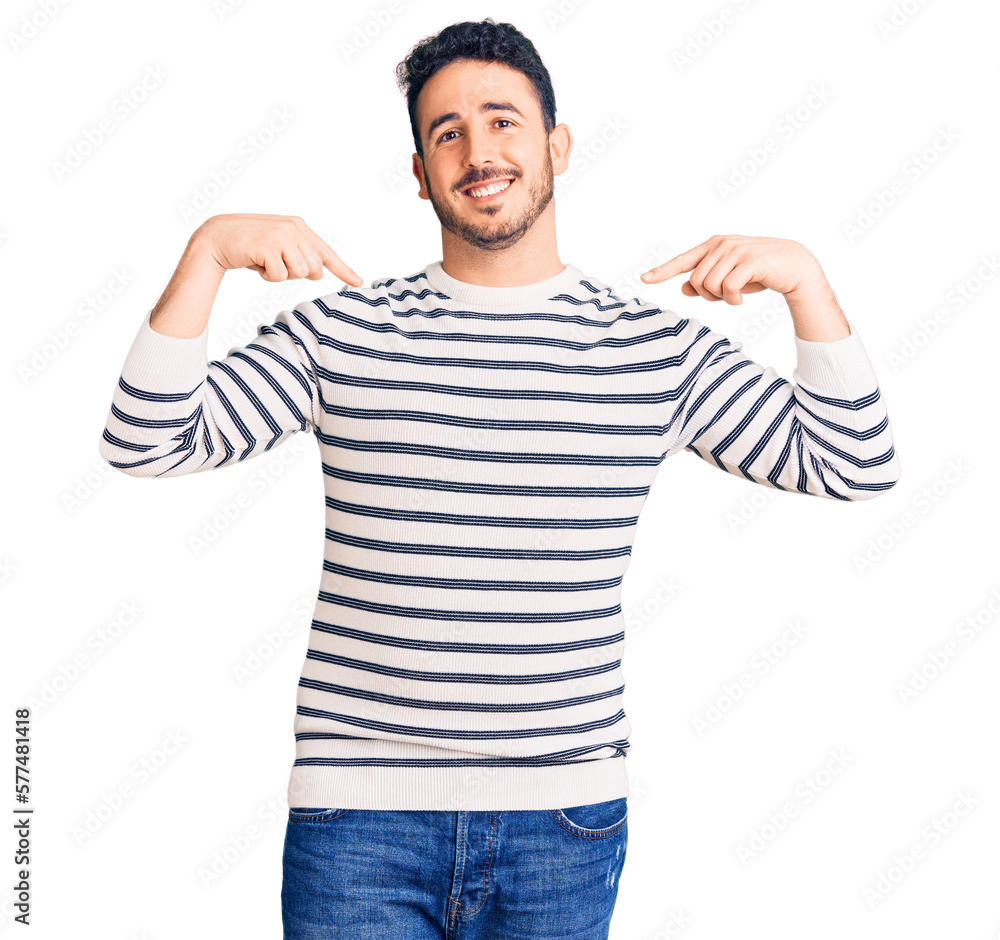 Young hispanic man wearing casual clothes looking confident with smile on face, pointing oneself with fingers proud and happy. Young hispanic man wearing casual clothes looking confident with smile on face, pointing oneself with fingers proud and happy.