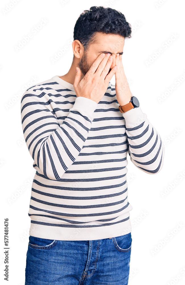 Young hispanic man wearing casual clothes rubbing eyes for fatigue and headache, sleepy and tired expression. vision problem Young hispanic man wearing casual clothes rubbing eyes for fatigue and headache, sleepy and tired expression. vision problem