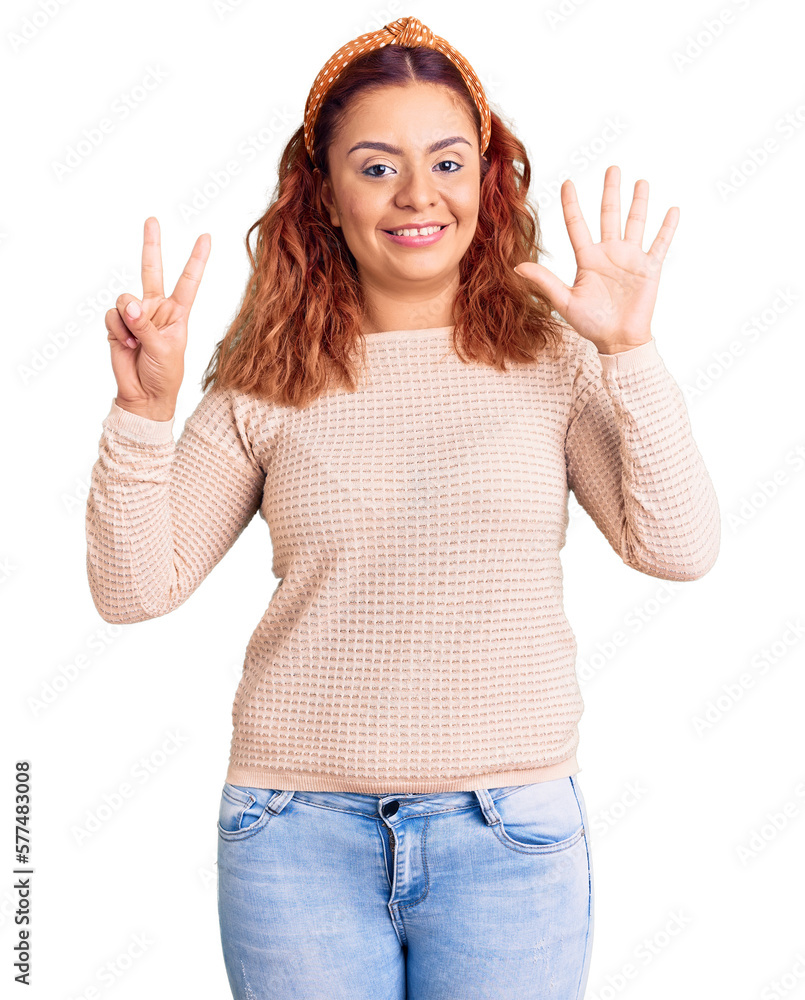 Young latin woman wearing casual clothes and diadem showing and pointing up with fingers number seven while smiling confident and happy. Young latin woman wearing casual clothes and diadem showing and pointing up with fingers number seven while smiling confident and happy.