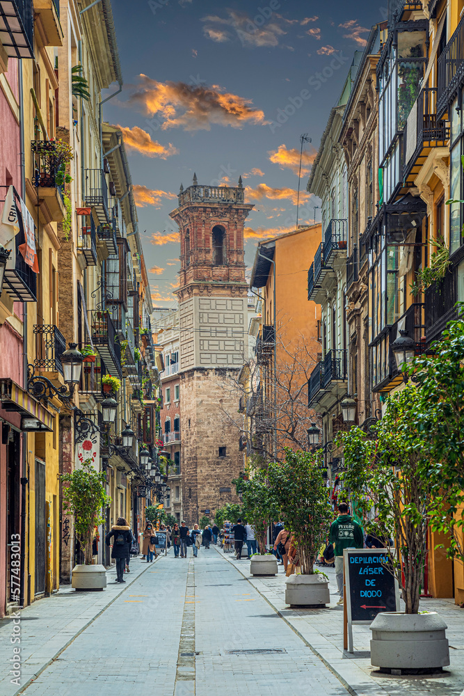 Fototapeta premium View of Carrer dels Serrans, with Torre de Sant Bartomeu in background, Valencia, Spain