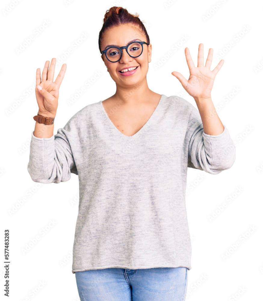 Young latin woman wearing casual clothes showing and pointing up with fingers number nine while smiling confident and happy. Young latin woman wearing casual clothes showing and pointing up with fingers number nine while smiling confident and happy.