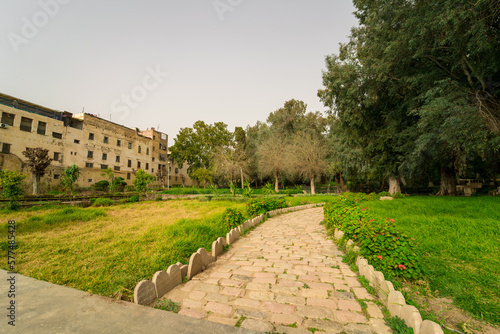 Cobblestone footpath at Jnan Sbil Gardens in the old town of Fez, Morocco photo