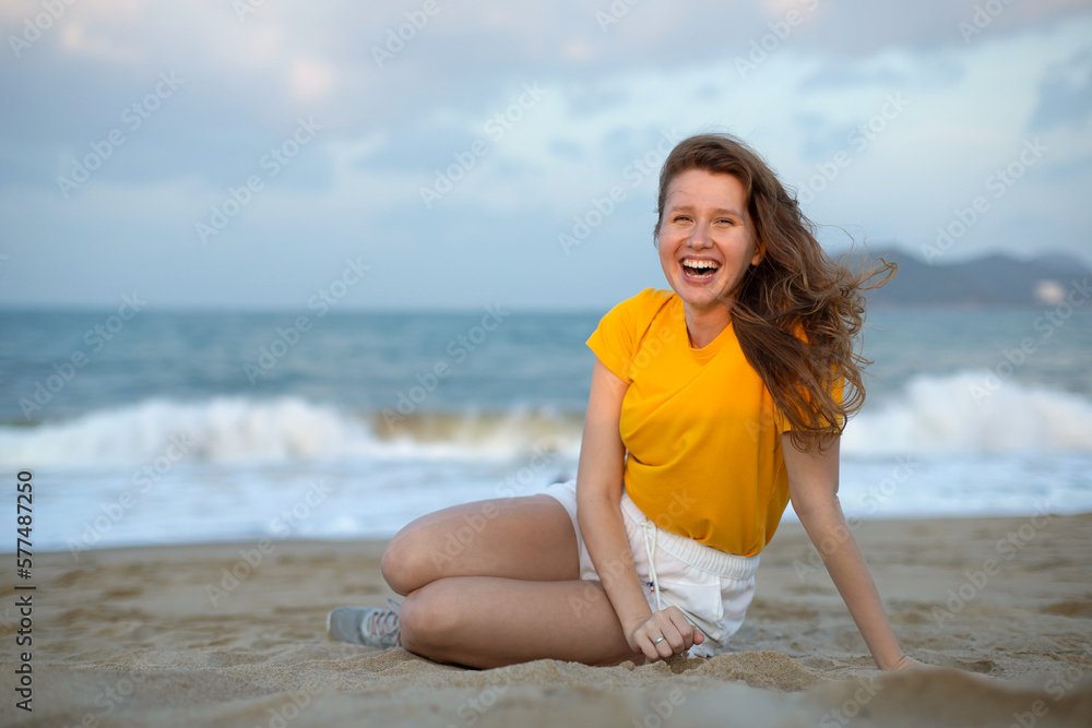Portrait of happy girl, young carefree woman enjoying summer vacation on sea, walking on beach sand, smiling and having fun in tropical country, relaxing on nature. Summertime, happiness concept. Portrait of happy girl, young carefree woman enjoying summer vacation on sea, walking on beach sand, smiling and having fun in tropical country, relaxing on nature. Summertime, happiness concept.