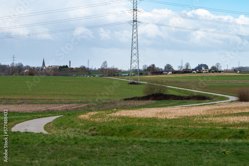Bending road through the agriculture fields at Relegem, Belgium
