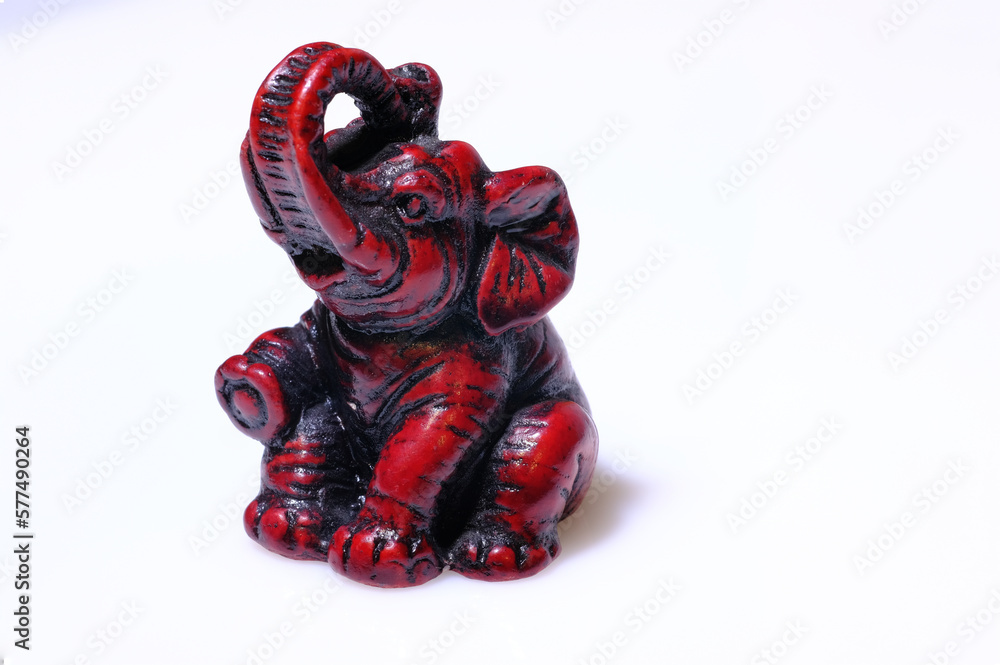 Naklejka premium Wooden african elephant on isolated white background, souvenir object