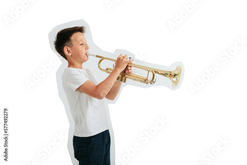 a child playing trumpet on turquoise background