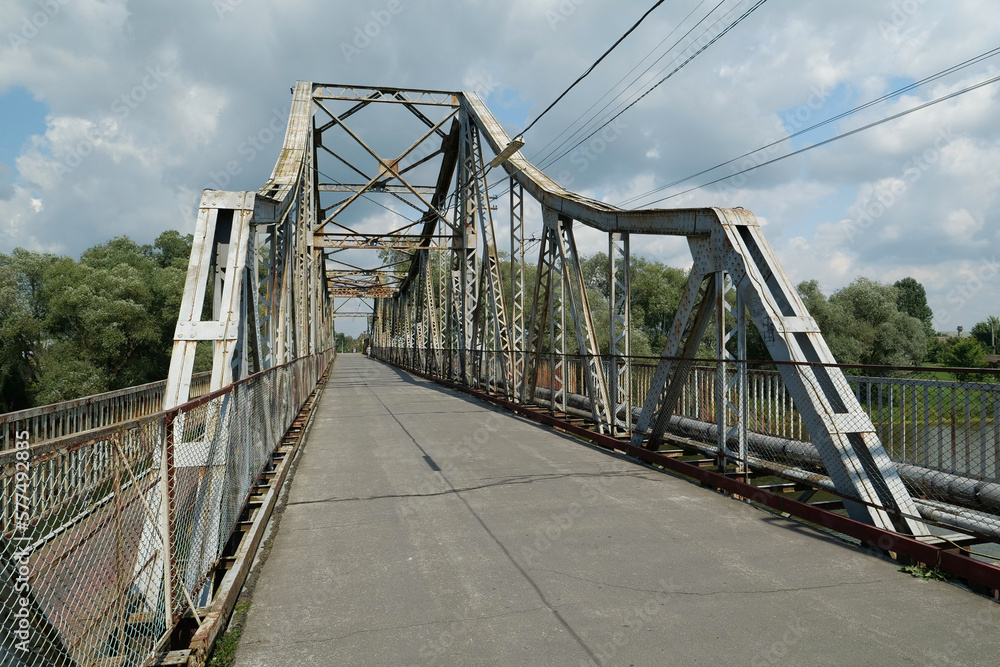 Old metal bridge across Dniester river in the city of Halych, western Ukraine Old metal bridge across Dniester river in the city of Halych, western Ukraine